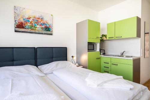 Katil atau katil-katil dalam bilik di FeelGood Apartments SmartLiving | contactless check-in