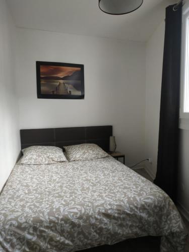 Ένα ή περισσότερα κρεβάτια σε δωμάτιο στο Appartement - Bords de Loire ORLEANS