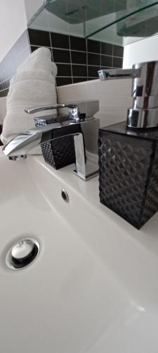 a bathroom counter with a faucet and a sink at Casa Ferreri in Santa Ninfa
