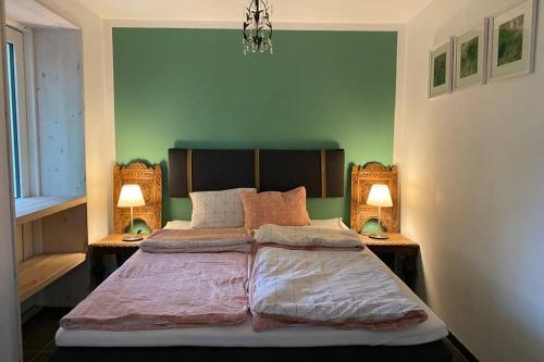 A bed or beds in a room at Oak Cottage near Rønne & Beach