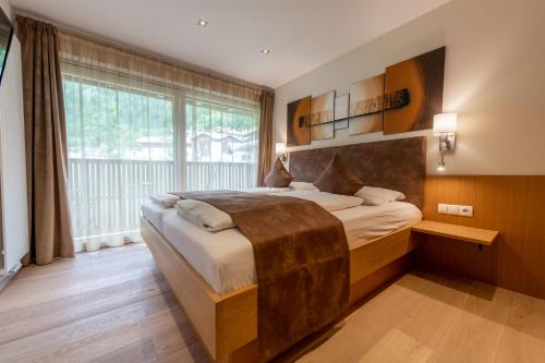 Postel nebo postele na pokoji v ubytování Lapis Monti - Apartments & Suites
