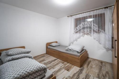 Ліжко або ліжка в номері Michalka 1 - Domki pod Leskowcem