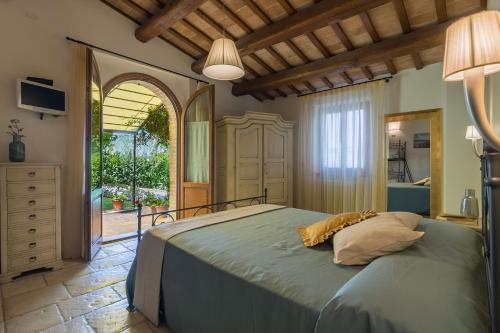 a bedroom with a bed and a large window at Villa Design in Pergola