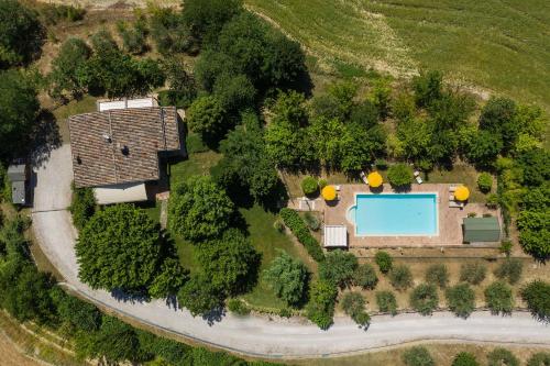 an overhead view of a house with a swimming pool at Villa Design in Pergola