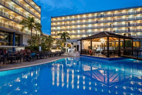 a large swimming pool in a hotel room at Sol Costa Daurada in Salou