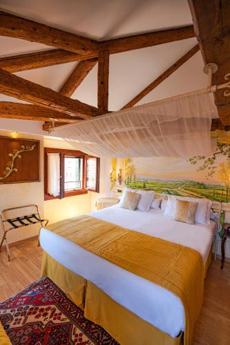 a bedroom with a large bed in a room at Hotel Al Piave in Venice