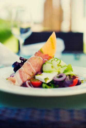 a plate of food on a table at Premier Splendid Inn Umhlanga in Durban