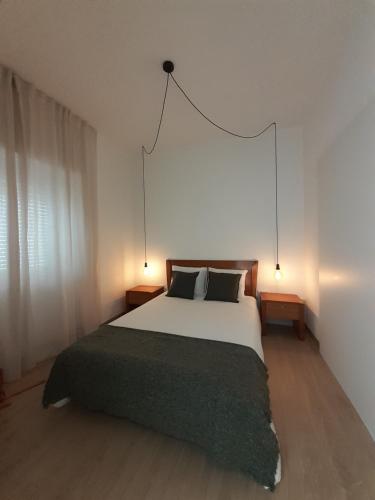 Postel nebo postele na pokoji v ubytování Casa Encantada - Golegã