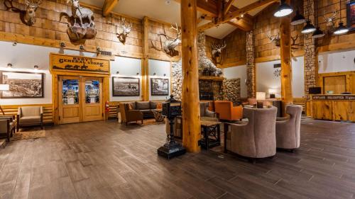 a lobby of a lodge with couches and tables at Best Western PLUS Ruby's Inn in Bryce Canyon