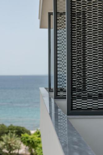 a view of the ocean from a building with a window at Bitzaro Boutique Hotel in Zakynthos Town