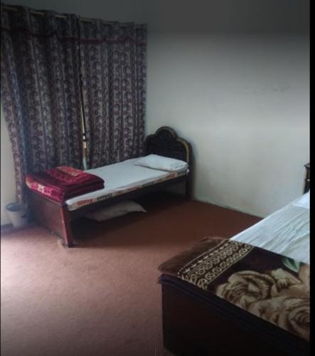 En eller flere senger på et rom på Fahad Guest House And Restaurant