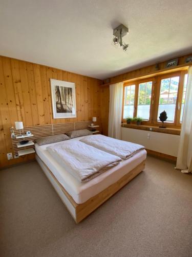 Postel nebo postele na pokoji v ubytování Ferienwohnung Résidence Sonnegg - Hein