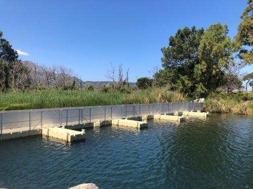 a bridge over a body of water at Camping Dolce Vita in Calvi