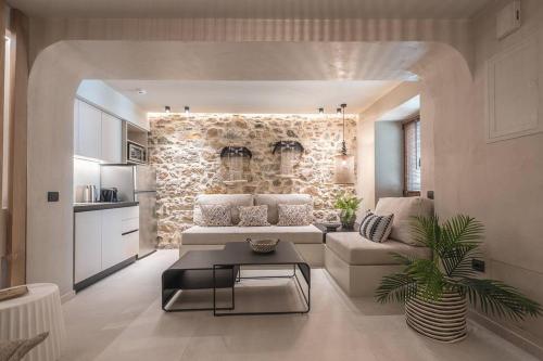 a living room with a couch and a table at Apollonos 28 Luxury Suites in Athens