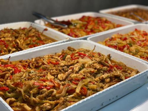 a buffet of different types of food in trays at Hotel Sorra Daurada Splash in Malgrat de Mar