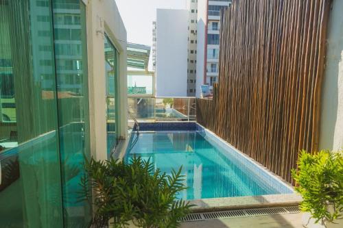 Casa ampla com área de lazer na praia em Ilhéus