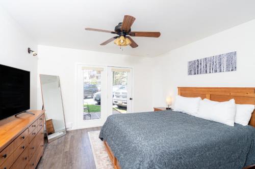a bedroom with a bed and a ceiling fan at Viking Lodge 109 - Viking Venue in Telluride