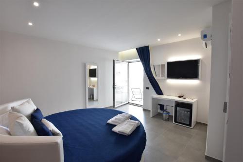 Ένα ή περισσότερα κρεβάτια σε δωμάτιο στο Hotel Sporting Club