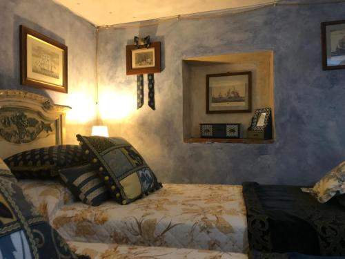 a bedroom with a bed and a mirror at Il Priorato in Pescia