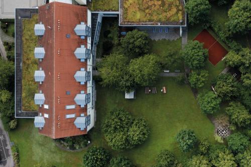 an overhead view of a building with a yard at Seminaris Hotel Bad Boll in Bad Boll