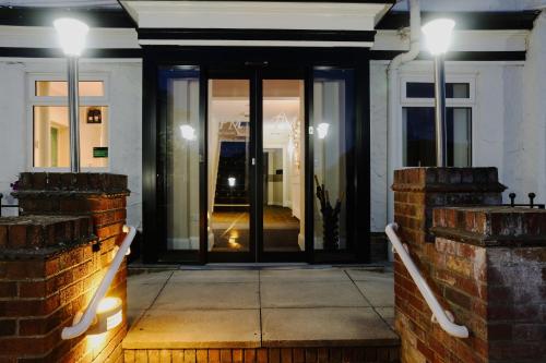 a front door of a house at night at Park Manor Hotel in Scarborough