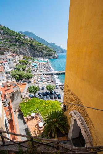 a view of a beach from a building at Palazzo Vingius in Minori