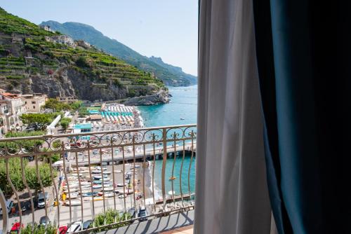 a view of the water from a hotel room at Palazzo Vingius in Minori