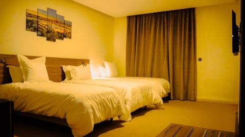 Postel nebo postele na pokoji v ubytování EL MOUSSAFIR HOTEL