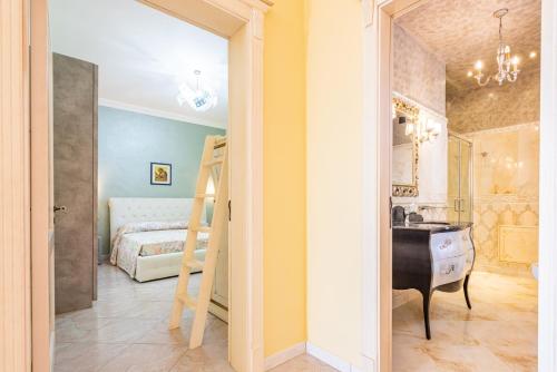a room with a bedroom with a bed and a desk at Villa Vanessa in Leuca