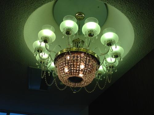 a chandelier hanging from a ceiling in a room at Granvillage Toya Daiwa Ryokan Annex in Lake Toya