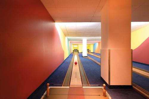 a bowling alley with a ball on the lanes at Seminaris Hotel Bad Honnef in Bad Honnef am Rhein
