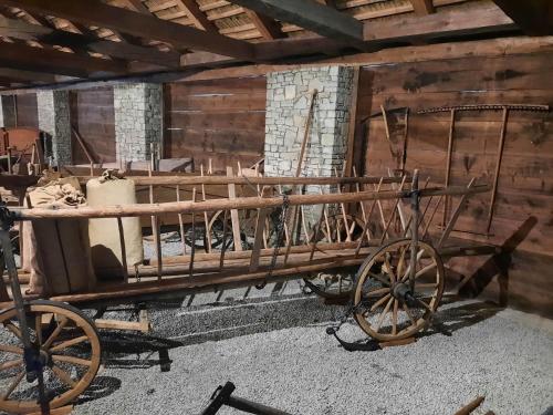 a wooden horse drawn cart in a barn at V přírodě na okraji Frenštátu pod Radhoštěm in Frenštát pod Radhoštěm