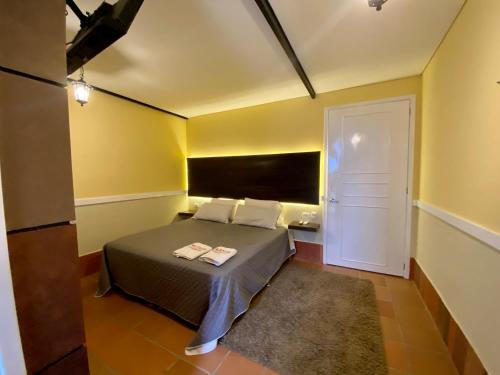 Postel nebo postele na pokoji v ubytování HOTEL CAMPESTRE MANOA