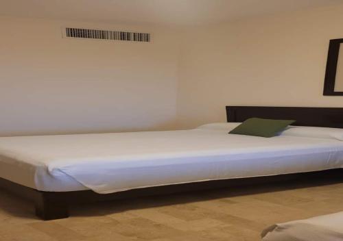 A bed or beds in a room at Vidanta Puerto Peñasco