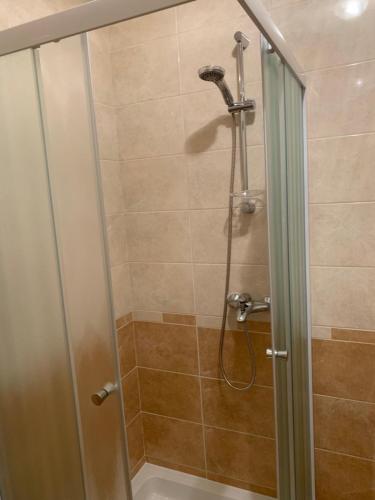 a bathroom with a shower with a glass door at Vinarija Zlatar in Zlatar