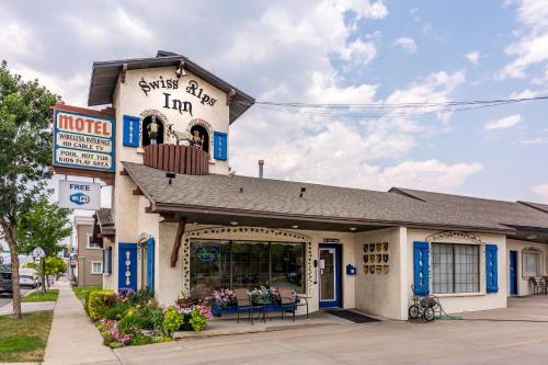 a building with a sign that reads sushi alley inn at Swiss Alps Inn in Heber City