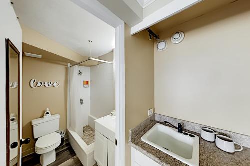 a bathroom with a sink and a toilet at Hawaiian Monarch 3707B condo in Honolulu