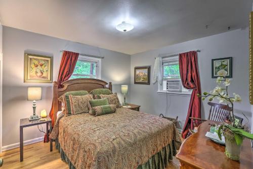 a bedroom with a bed and two windows at Relaxing Golden Getaway with Grill Less Than 1 Mi to Town! in Golden