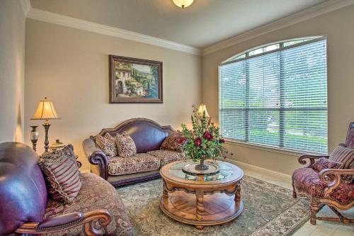 a living room with couches and a table and a window at 4 Mi to Grapevine Lake Texas Home with Media Room in Flower Mound
