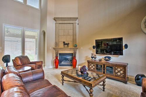 a living room with a couch and a fireplace at 4 Mi to Grapevine Lake Texas Home with Media Room in Flower Mound