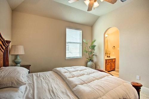 a bedroom with a bed and a ceiling fan at 4 Mi to Grapevine Lake Texas Home with Media Room in Flower Mound