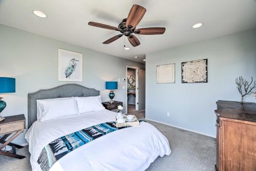 a bedroom with a bed and a ceiling fan at Seattle Retreat with Canal and Mountain Rooftop Views! in Seattle