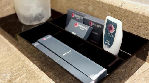 a black box with a bunch of remote controls at Shakti Hotel Bandung in Bandung