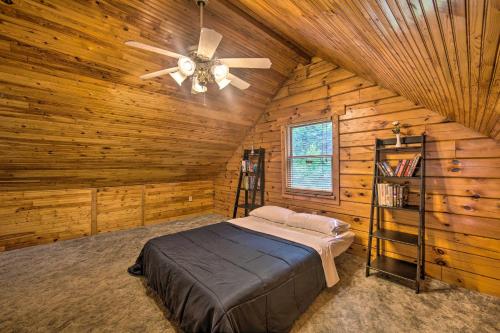 a bedroom with a bed and a ceiling fan at Cozy Family-Friendly Pine Grove Cabin with Fire Pit! in Pine Grove