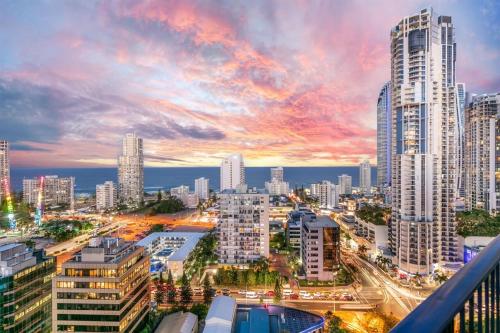 a city skyline with tall buildings at dusk at Condor Apartments by Gold Coast Premium in Gold Coast