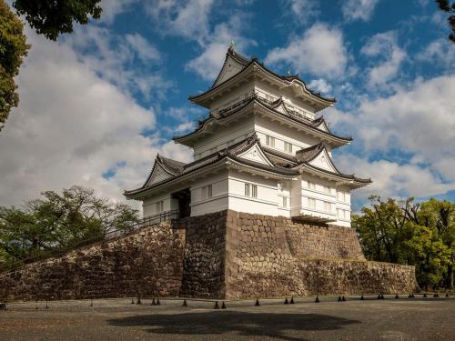 a tall tower on top of a stone wall at Odawara Terminal Hotel in Odawara