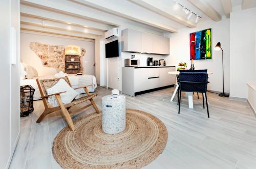a large living room with a kitchen and a living room at Yellow House Rovinj in Rovinj