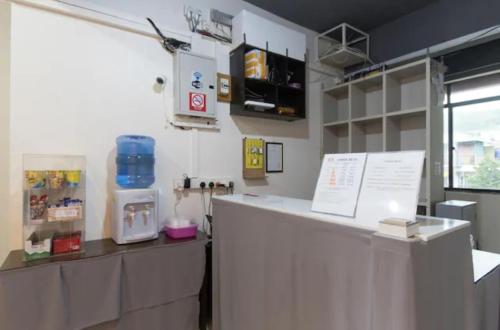 a kitchen with a counter in a room at Lodge 88 (1) in Ranau