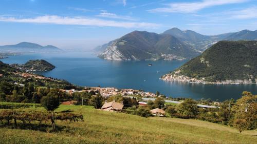a view of a large body of water with mountains at Appartamento seminterrato Villa Sveva Franciacorta in Ome