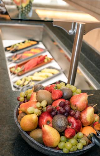 a bowl of fruit sitting on top of a counter at Hotel Almhof in Galtür